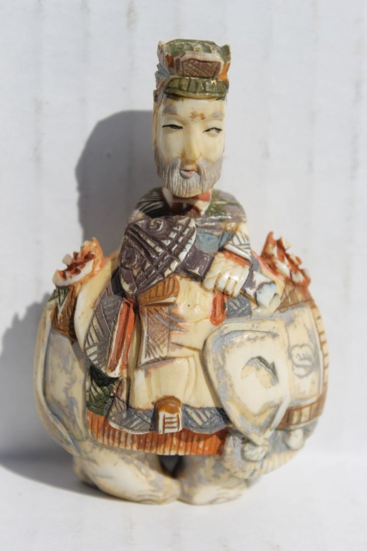 Chinese carved painted ivory figural snuff bottle of a: Chinese carved painted ivory figural snuff bottle of a man riding an elephant - 3" tall