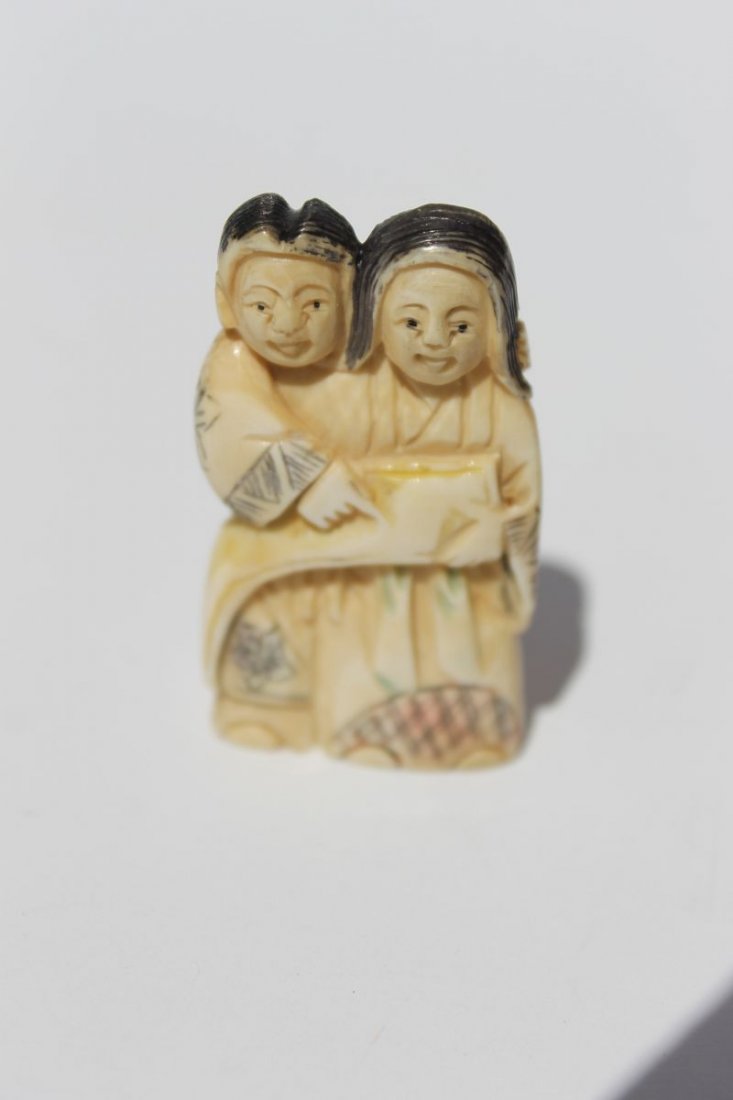 Asian carved ivory & paint dec netsuke of a couple -: Asian carved ivory & paint dec netsuke of a couple - sgnd - 2" tall