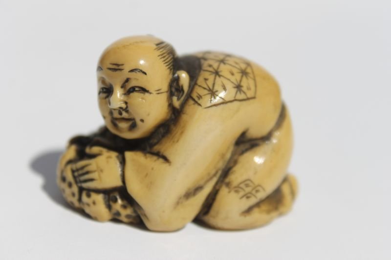 Asian carved ivory netsuke of a man w a pumpkin - 1: Asian carved ivory netsuke of a man w a pumpkin - 1 1/4" - sgnd