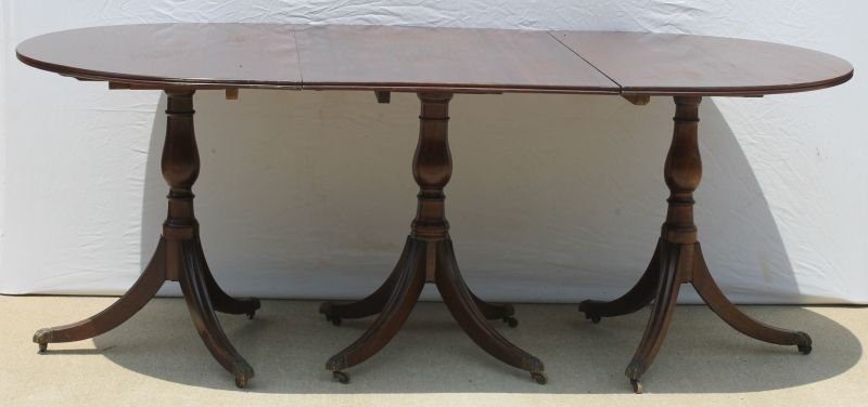 very rare NY or Boston desirably diminutive (possibly a: very rare NY or Boston desirably diminutive (possibly a child's or salesman's sample) mahog Duncan Phyfe style period 3 section banquet table w molded top & legs ending in brass claw & caster feet - w
