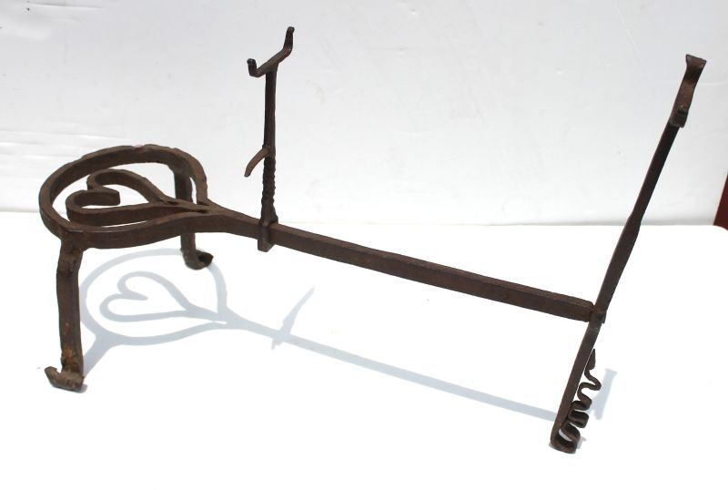 exceptional & rare early 18thC PA forged iron: exceptional & rare early 18thC PA forged iron trivet/cooking stand w ovoid pot rest, forged heart within, tripod legs w rolled feet & rear leg foot designed as undulating snake - Note: fork/pot handle
