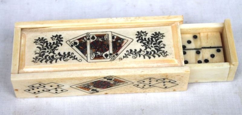 carved bone small box w scrimshawed card & domino motif: carved bone small box w scrimshawed card & domino motif - w many scrimshaw bone dominoes in interior pull out drawer - 4 1/4" long