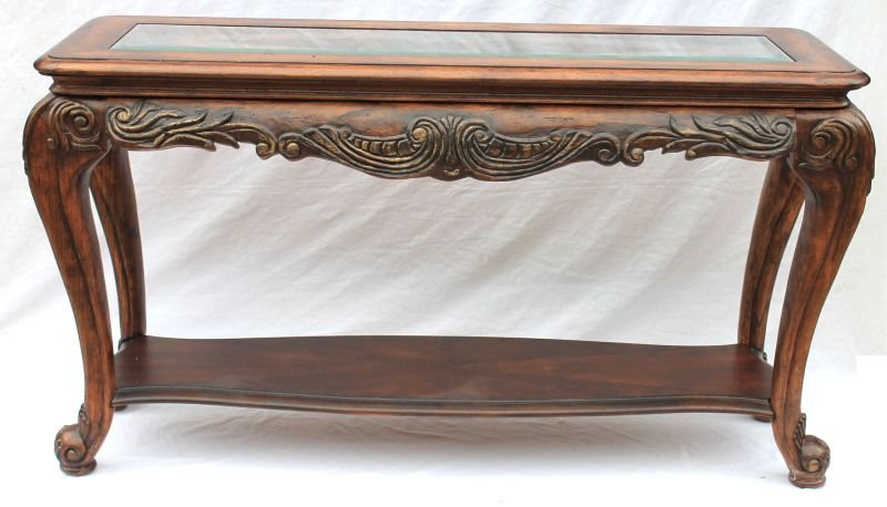 Large 20thC carved behind the sofa table on large: Large 20thC carved behind the sofa table on large padded ball feet w beveled glass inset top - 55" wide x 30 1/2" tall x 20" deep