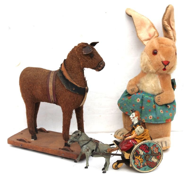Good lot of 3 antique toys incl a ca 1860 German mohair: Good lot of 3 antique toys incl a ca 1860 German mohair covered wooden platform 9" horse pull toy, a ca late 19thC Lehmann tin w-up mule cart w clown driver & ca 1930 stuffed w-up musical 12" rabbit