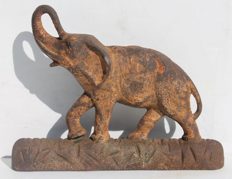 ca 1920 rare "Trunk Up" (good luck symbol) elephant: ca 1920 rare "Trunk Up" (good luck symbol) elephant cast iron doorstop in orig yellow oxidized paint - 11" long x 9" tall