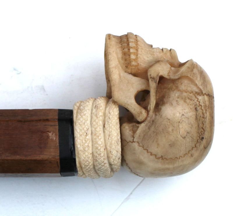elaborately carved whale bone cane featuring snake in: elaborately carved whale bone cane featuring snake in skull & tulipwood shaft - 38 1/2" long