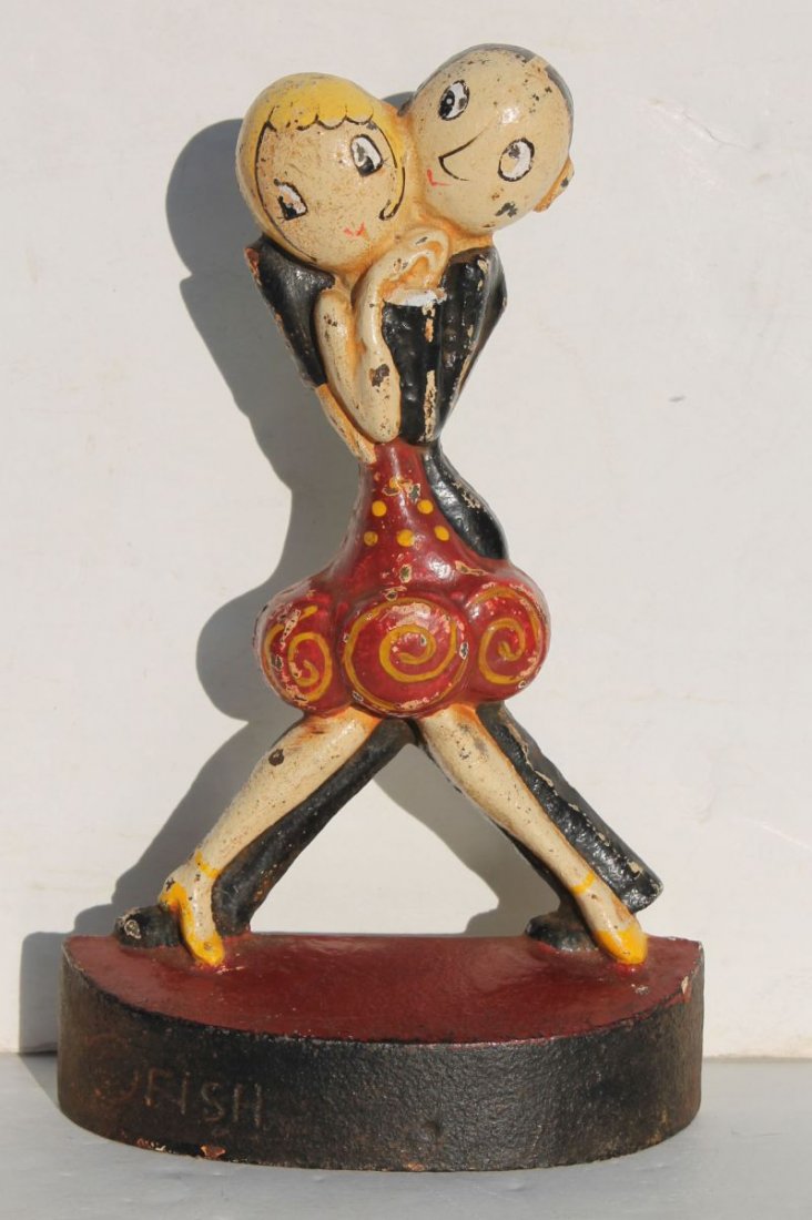 rare ca 1920 cast iron "Charleston Dancers" doorstop by: rare ca 1920 cast iron "Charleston Dancers" doorstop by Hubley marked "FISH" in vibrant orig paint - 8 3/4" tall