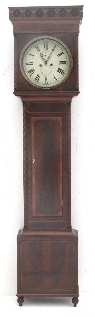 ca 1830's NY State mahog tall case clock w round enamel: ca 1830's NY State mahog tall case clock w round enameled dial & brass works featuring orig ball feet, unusual carved rosettes, weights & pendulum - 89" tall
