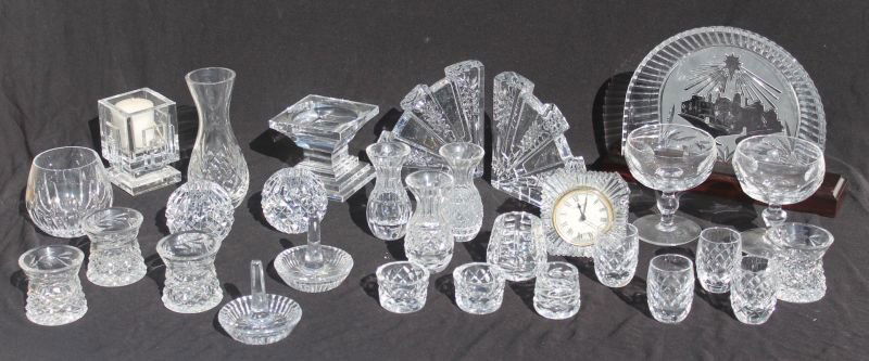 large lot of sgnd Waterford glass - approx 27 pcs incl : large lot of sgnd Waterford glass - approx 27 pcs incl nativity back drop, clock, bkends, candlesticks, ring holders, vases, cordials, etc