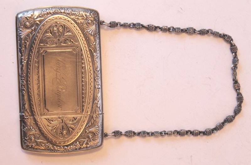 antique Gorham sterling silver card case on silver chai: antique Gorham sterling silver card case on silver chain w engraved name "Mary Bigelow" & floral engraved dec - 4" long x 2 1/2"