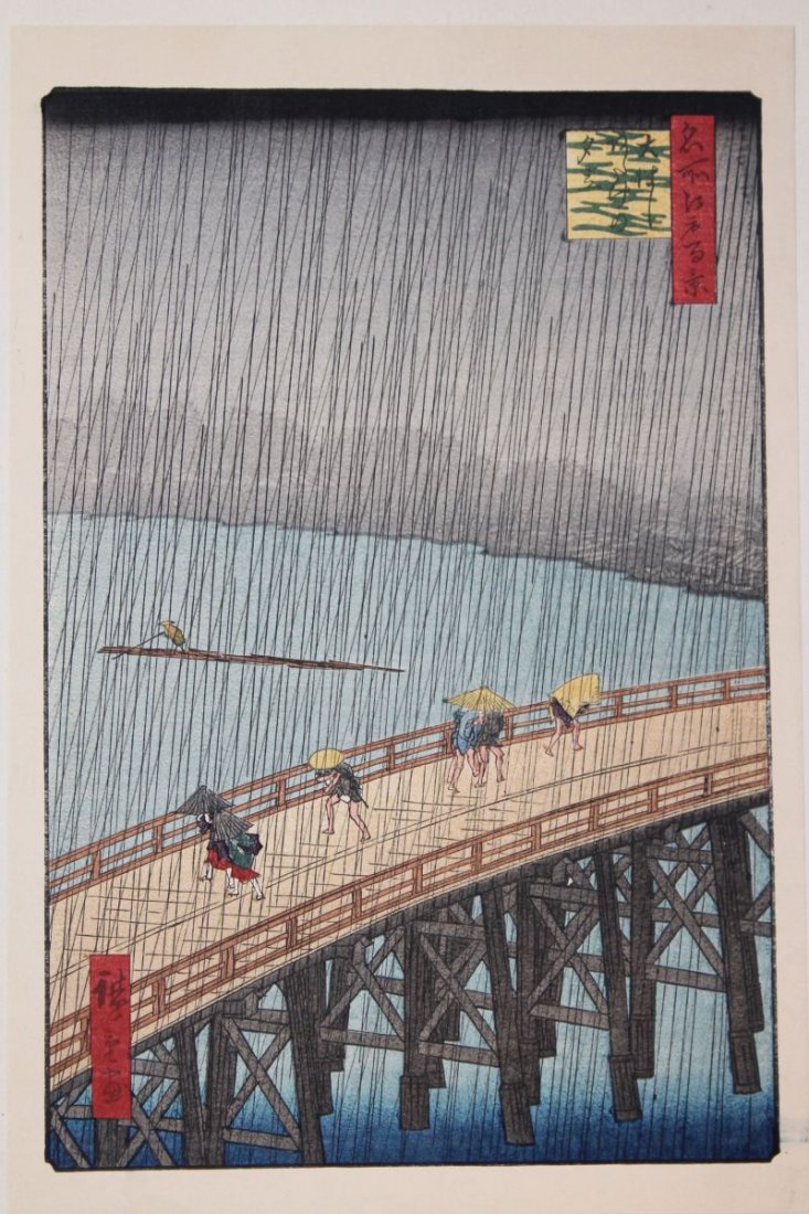 Japanese woodblock print of figures on bridge under: Japanese woodblock print of figures on bridge under umbrellas in a rain storm - 11 3/4" x 7 3/4"