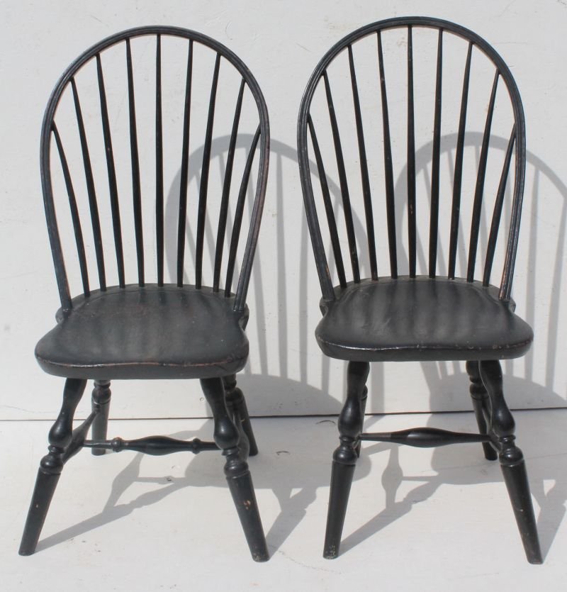 Near pr of 18thC New England 9 spindle bow back Windsor: Near pr of 18thC New England 9 spindle bow back Windsor side chairs in desirable old black paint over orig Spanish brown - featuring strong bulbous turnings & tall backs - 38" tall