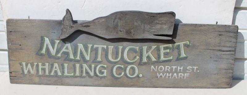 wooden carved & painted "Nantucket Whaling Company" sig: wooden carved & painted "Nantucket Whaling Company" sign w applied whale carved crest "North St. Wharf" - 39" long x 14" tall