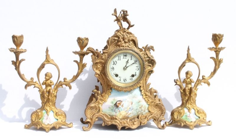 Gilded metal 3 piece clock garniture set w porcelain co: Gilded metal 3 piece clock garniture set w porcelain courtship scenes & putti figural mounts clocks - 14" tall (imperfections to the metal)