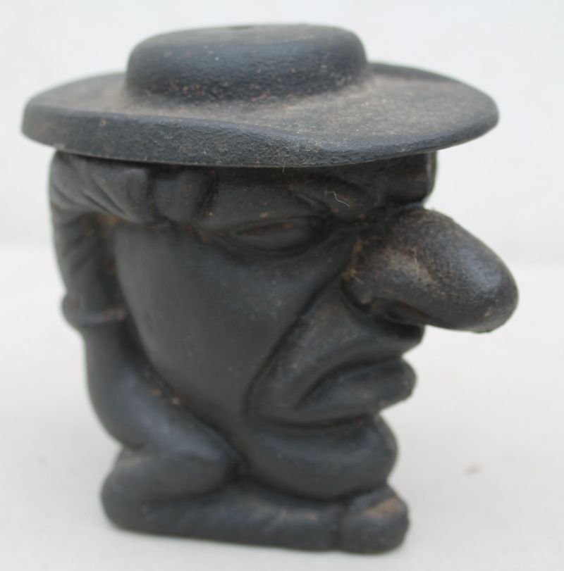 cast iron "Punch" figural string holder - 4" tall: cast iron "Punch" figural string holder - 4" tall
