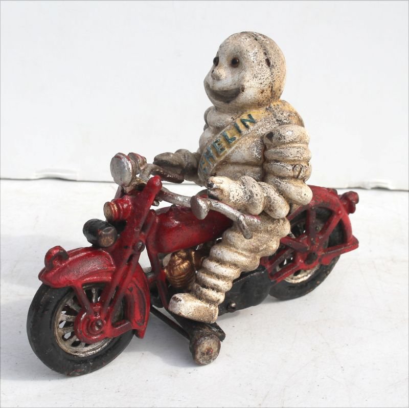 unusual cast iron "Michelin Man" on motorcycle toy - 8: unusual cast iron "Michelin Man" on motorcycle toy - 8 1/4" long x 6 1/2" tall