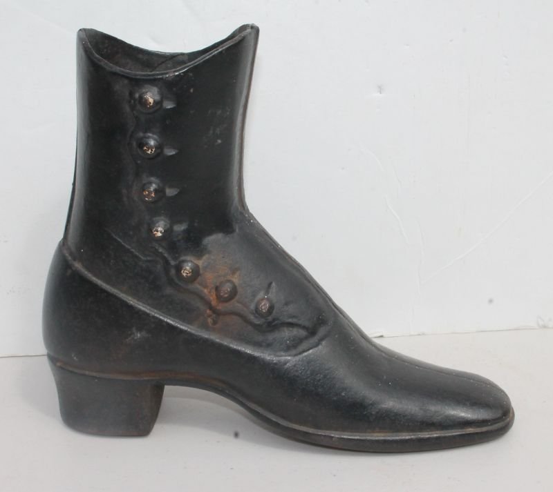 antique 19thC cast iron high button Vict shoe doorstop: antique 19thC cast iron high button Vict shoe doorstop - 8 1/2" tall - Magdefrau estate