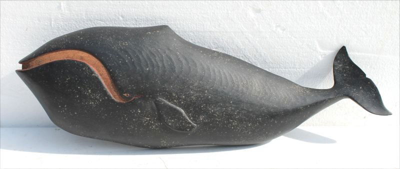 Folk Art carved Right Whale by Clark Voorhees: Folk Art carved Right Whale by Clark Voorhees (1911-1980) in very nice orig cond featuring partially open mouth exposing the painted baleen w raised carved fluke & tail - sgnd on verso 18" long