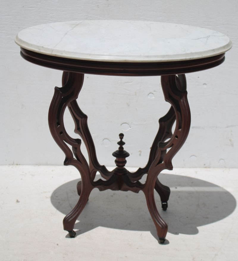 Fine Vict carved walnut oval marble top table on (1 of 1)