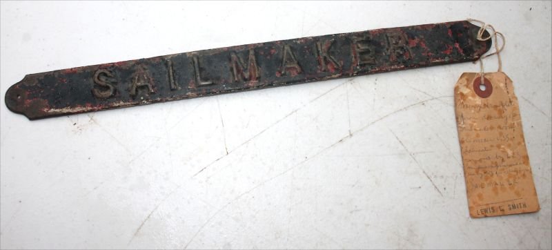 "Sailmaker" bronze sign w tag delineating its history: "Sailmaker" bronze sign w tag delineating its history "From Doorway of Sailmaker's room, old wooden USS Lancaster…" - 12 1/2" long