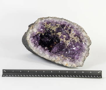 Amethyst Vug Geode with Calcite Crystals: Large Amethyst vug geode with secondary calcite crystals. 7" x 8" x 13". 13.2 pounds.