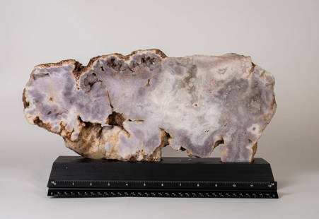 Pink Amethyst Buffalo on Wood Stand: Pink amethyst buffalo-shaped slab on wood stand. 8.5" x 14.5" x 3.5". 9.11 pounds.