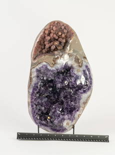 Dazzling Double-Chambered Pink and Purple Amethyst Geode: Double-chambered amethyst geode from Uruguay. One chamber is filled with pink amethyst stalactites, while the other is filled with deep purple amethyst crystals. Caused by distinct water flows into ea