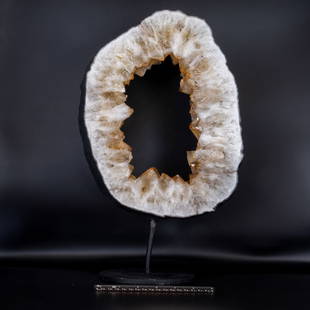 Citrine Geode Ring With Goethite Inclusions on Stand: Citrine geode ring with goethite inclusions on black metal stand. 16.5" x 10" x 6". 13.5 pounds.