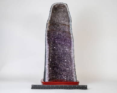 Tall Amethyst Cathedral Geode on Wood Stand: Twenty-one inch tall amethyst cathedral geode on wood stand. 24.8 pounds.