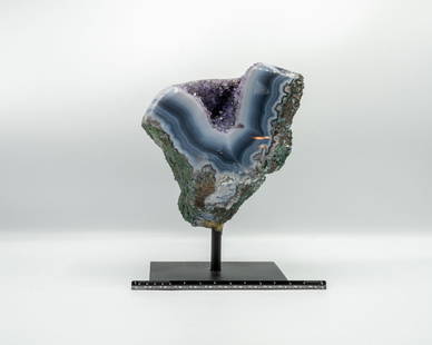 Amethyst and Agate Geode on Stand: Amethyst and agate geode with polished edges on black metal stand. 8" x 5.5" x 4.5". 5.12 pounds.