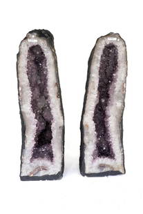 Huge Amethyst Cathedral Geode Pair: Huge and magnificent amethyst cathedral geode pair. Large amethyst crystals. 28"H, 8.75"W, 9"D and 29"H, 8.25"W, 10.5"D, respectively. 199.40 pounds total weight.