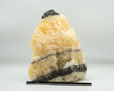 Mountaintop Yellow Calcite Formation: Yellow calcite formation resembling a mountaintop. 8" x 6.5" x 4.5". 8.1 pounds.