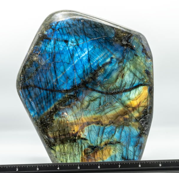 Large and Radiant Polished Labradorite Freeform: Large, radiant, polished labradorite freeform from Madagascar. 9" x 7.75" x 3.5". 14 pounds.