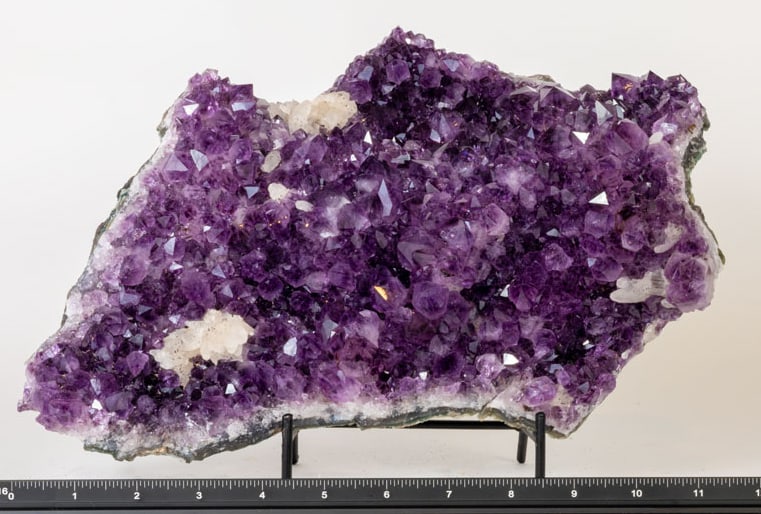Exceptional Quality Amethyst Cluster With Fluorescent Calcite Deposits: Exceptional quality amethyst cluster with dark deep-purple crystals and fluorescent calcite deposits. 7.5" x 11" x 3.5". 8 pounds, 11 ounces.
