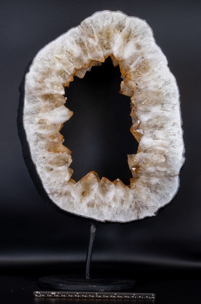 Citrine Geode Ring With Goethite Inclusions on Stand: Citrine geode ring with goethite inclusions on black metal stand. 16.5" x 10" x 6". 13 pounds, 5 ounces.