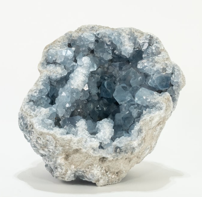 Deep Blue Celestite Geode: Beautiful deep blue celestite geode from Madagascar. 8” x 8” x 6”. 17 pounds, 10 ounces.