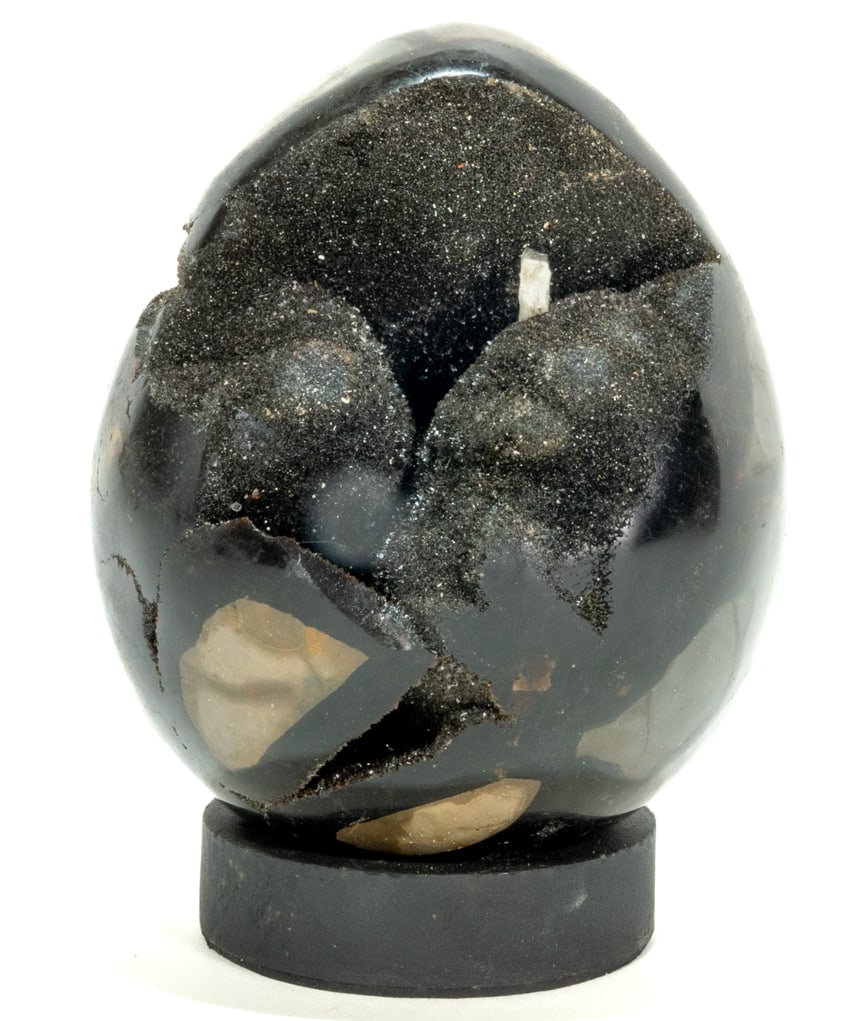 Septarian Dragon Egg Geode: Septarian dragon egg geode from Madagascar. 5.5" x 4.25" x 4.25". 5 pounds, 2 ounces.