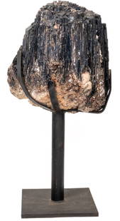 Colossal 200LB Black Tourmaline Specimen on Stand: Huge reduction! Colossal black tourmaline specimen on black metal stand. The centerpiece of any collection or home. 31 x 15 x 13 inches. 200 pounds.