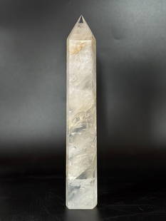 Quartz Crystal Obelisk: Quartz crystal obelisk with inclusions. 9” x 1.75” x 1”. 1 pound, 6 ounces.