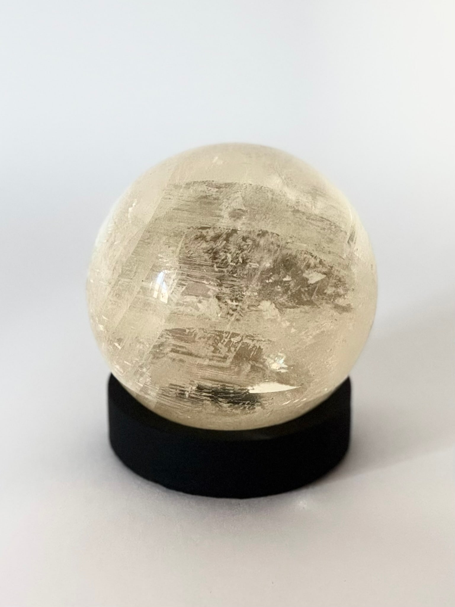Polished Quartz Sphere With Inclusions: Polished quartz sphere with inclusions. 3.5" x 3.5" x 3.5". 1,074 grams.