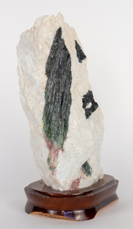 Large Watermelon Tourmaline Formation on Wood Stand: Large watermelon tourmaline specimen on wood stand from Brazil. 10.75" x 6.5" x 4.25". 9 pounds, 10 ounces.