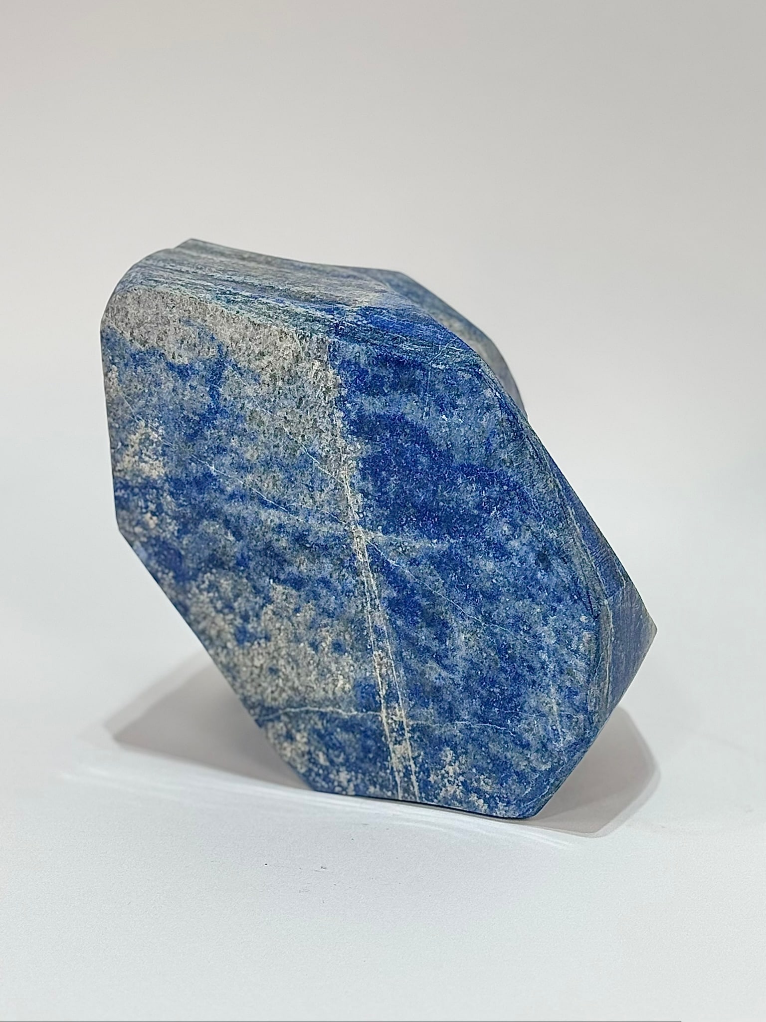 Large Polished Denim Lapis Lazuli Freeform: Large polished denim lapis lazuli freeform from Afghanistan. 6.25" x 6" x 4.25". 13 pounds, 7 ounces.