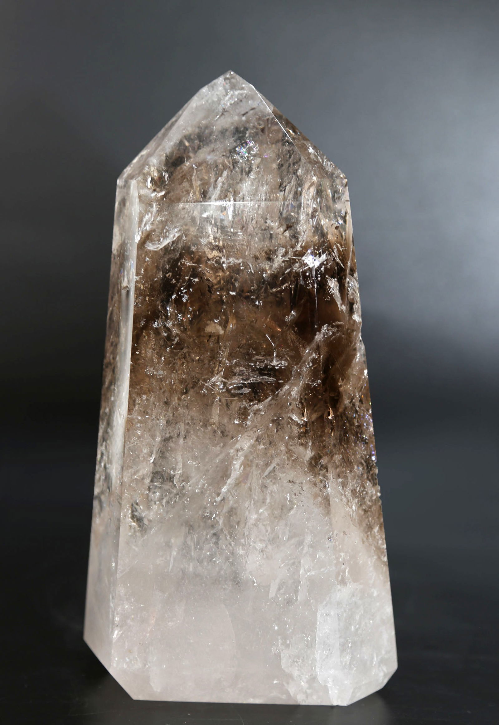 Clear and Smoky Quartz Crystal Obelisk: Clear and smoky quartz crystal obelisk with incredible inclusions. 9” x 4.75” x 3”. 6 pounds, 11 ounces.