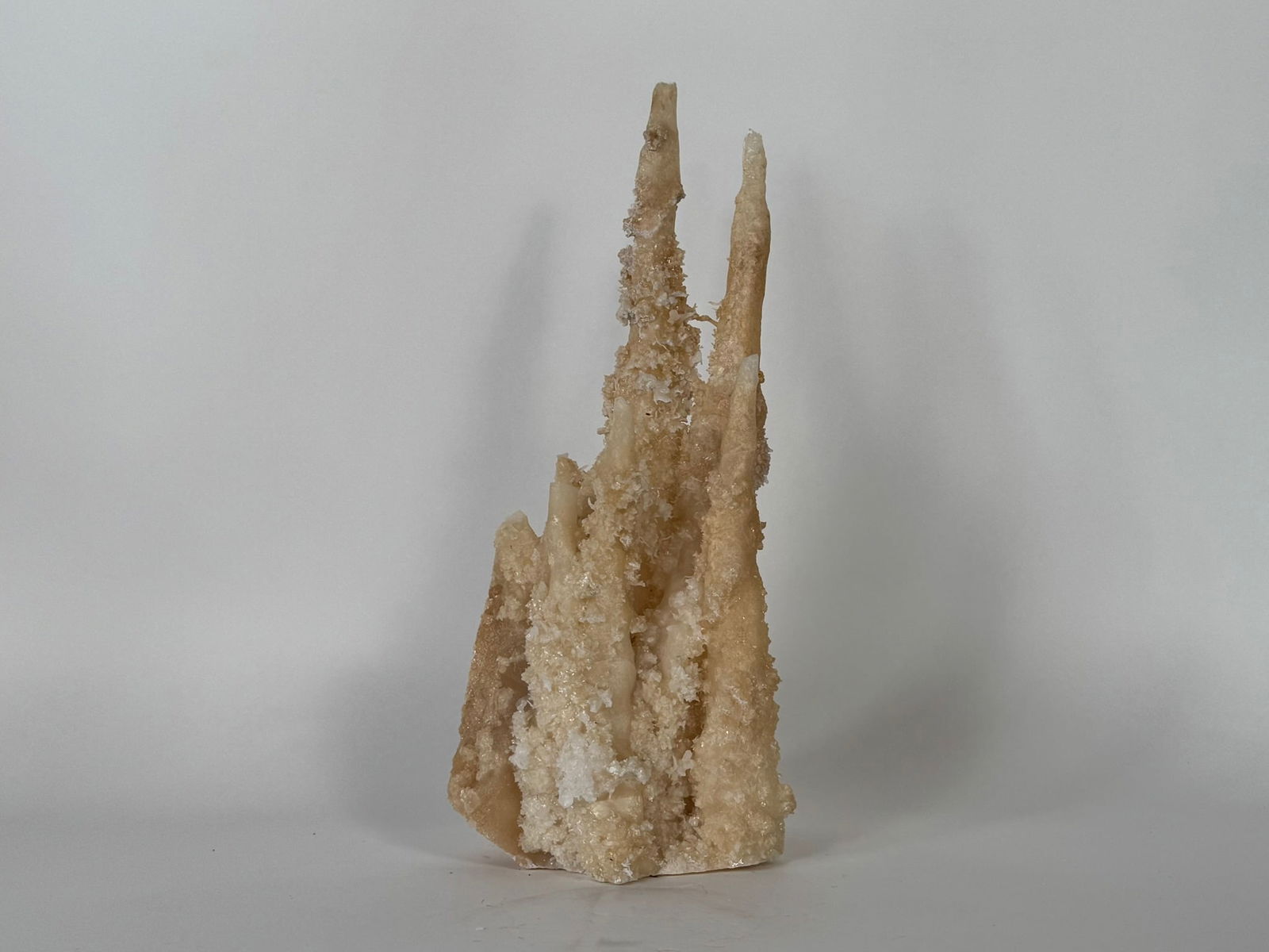 Calcite Stalactite Formation: Stunning and rare calcite stalactite formation from China. 14” x 5.5” x 5”. 6 pounds, 15 ounces.