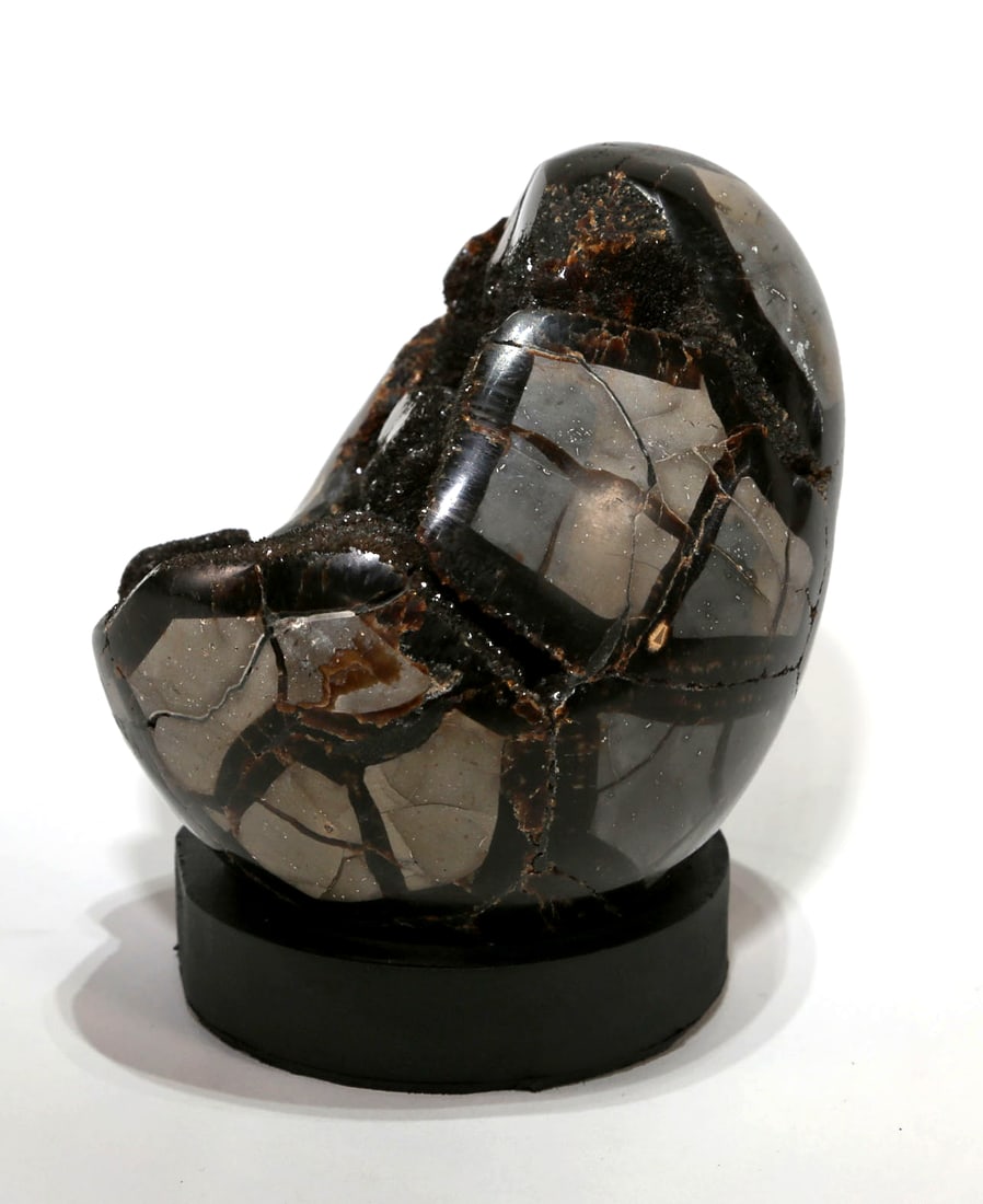 Septarian Dragon Egg Geode: Septarian Dragon Egg Geode from Madagascar. 5” x 4” x 4”. 3 pounds, 6 ounces.