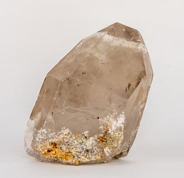 Large Quartz Crystal Point: Large quartz point with reflective inclusions. 7" x 3.5" x 4.5". 5 pounds, 11 ounces.