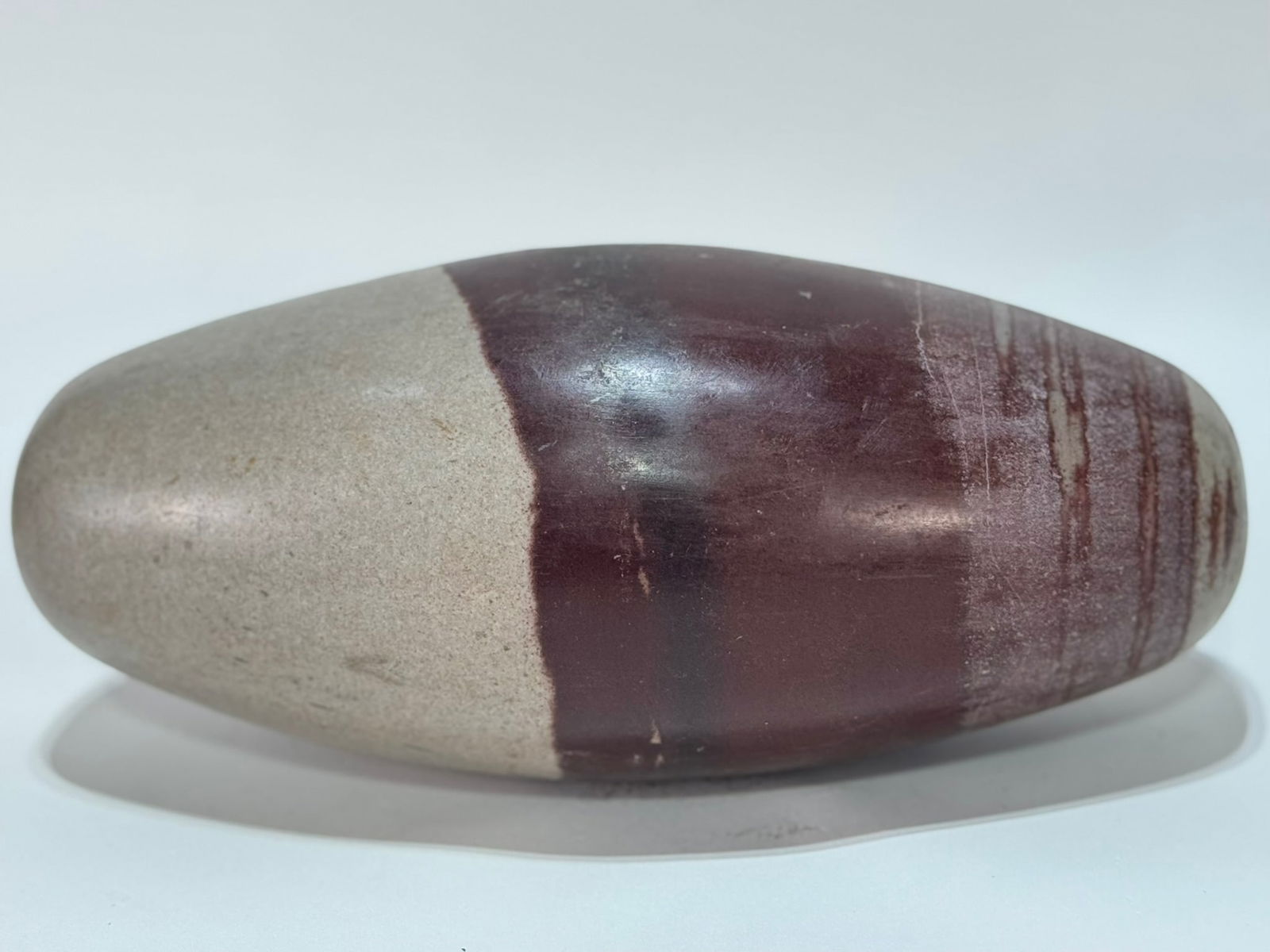 Large Shiva Lingam Meditation Stone: Large shiva lingam meditation stone from the Narmada River in India. 10" x 4.5” x 4.5”. 10 pounds, 2 ounces.