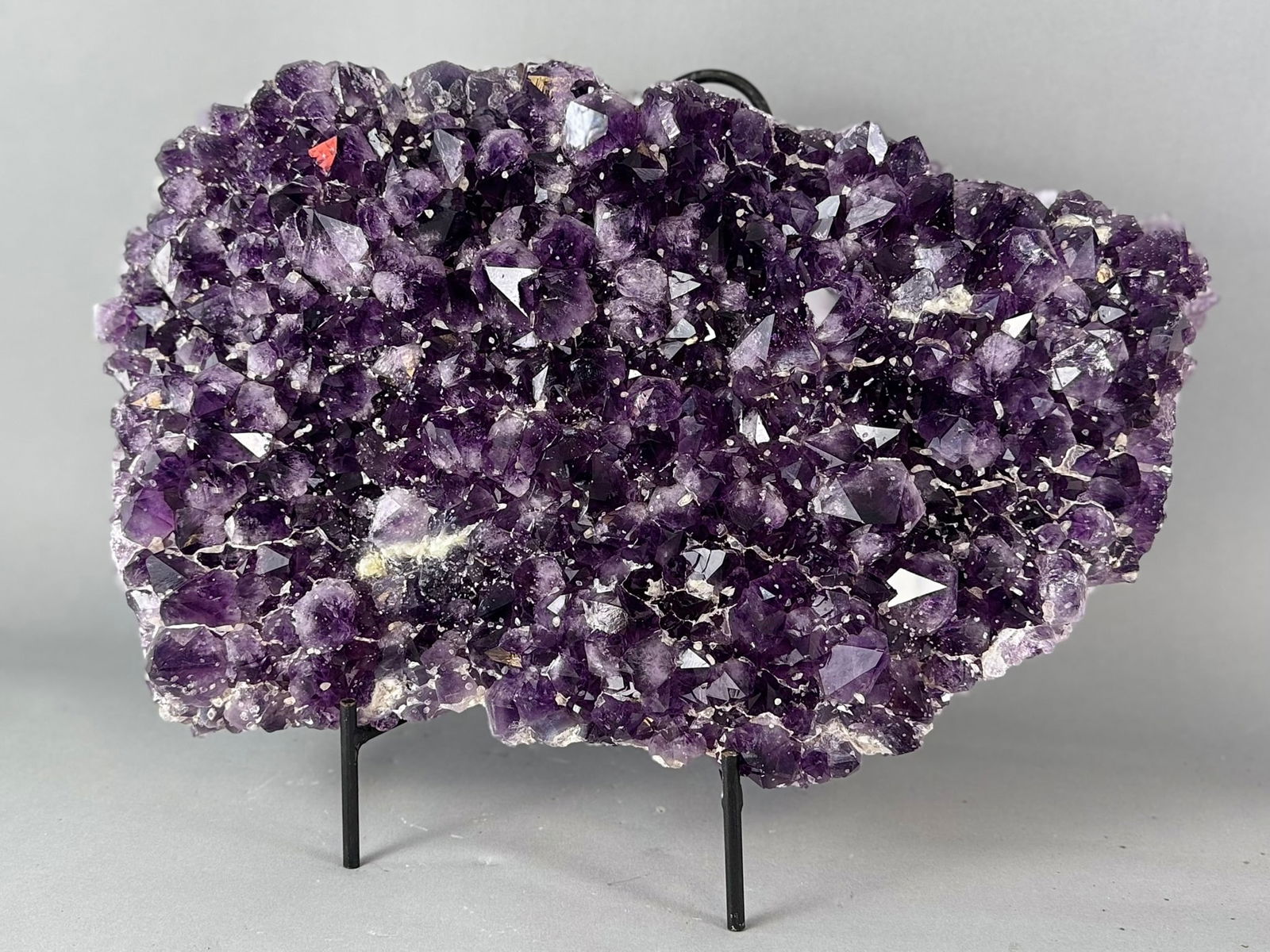 Large Amethyst Cluster Plate: Large amethyst cluster plate with calcite crystals from Brazil. 11" x 18" x 3". 43 pounds, 3 ounces.
