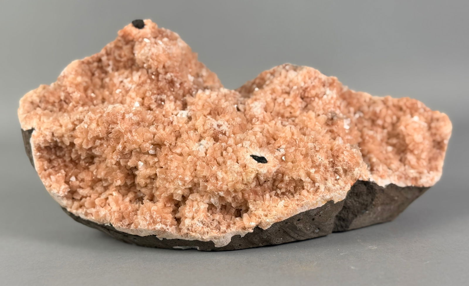 Pink Heulandite Formation: Pink heulandite formation from India. 5”x 10”x 3”. 5 pounds, 8 ounces.