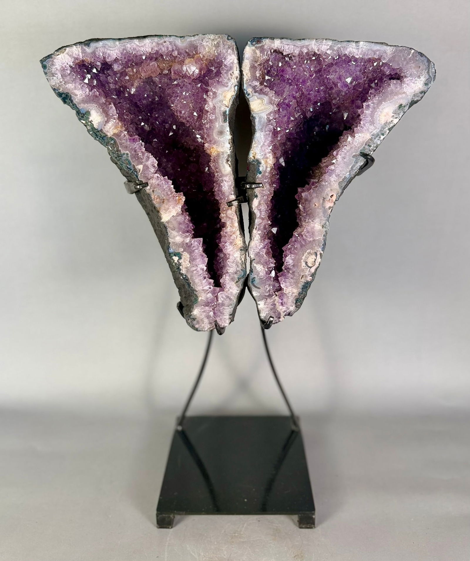 Amethyst Geode Butterfly Wings: Amethyst geode butterfly wings on stand from Brazil. 23” x 16” x 8". 42 pounds, 10 ounces.